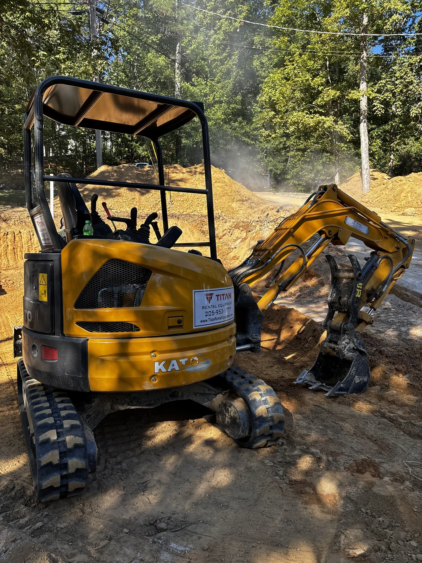 Mini excavator positioned at an active excavation site