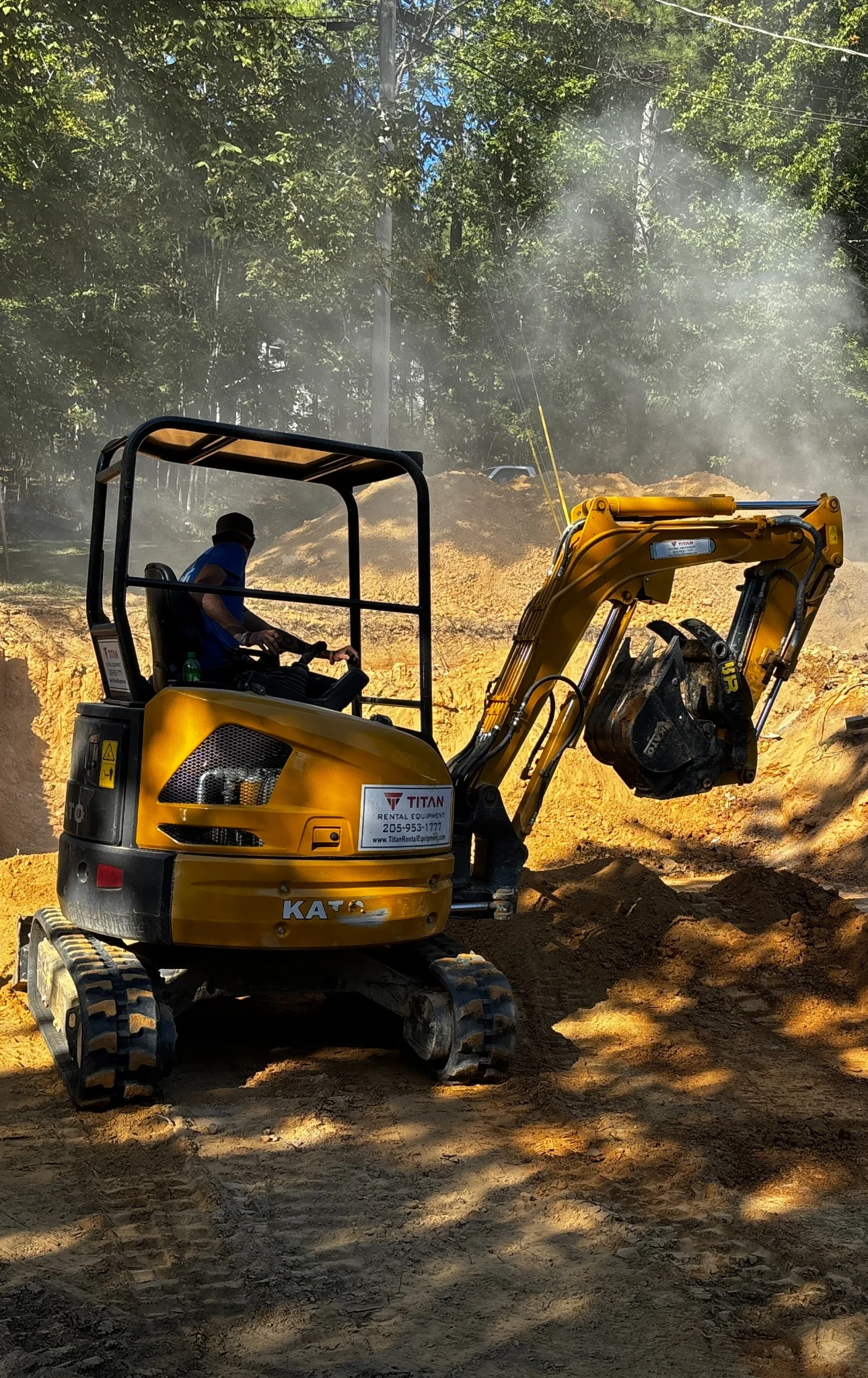 Excavating equipment working on a wooded property